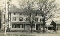 In 1779, Jacob Drake Jr. took over this beautiful old farmhouse, which was built around 1752, at the crossroads of Oakdale Road, Dover Chester Road and Main Street.  He converted it into an inn.  A few of the names it has held during its 183 years of operation were Jacob Drake's Tavern, Crossroads Hotel, Union Hotel, Flagstaff Inn, and Dean's Crossroads Inn.  After it burned down in 1962, the lot sat empty for some time until the Immediate Medical Care Center was built.