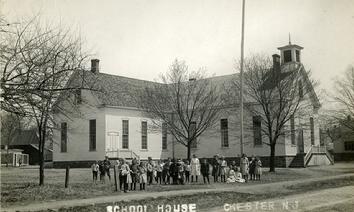 The first Chester School was moved to this location on Grove Street from Academy Lane and then added on to. When Williamson School was built in 1924, this school was then divided and made into four apartments and recently torn down to make way for an office building.