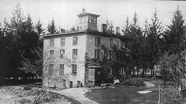 Daniel Budd built this stone, 26-room house in 1868, as a home for his family and for the use of the Chester Institute, which was a private seminary school for young ladies.  At the turn of the century, the Budd family changed the school into a boarding  house. In 1945,  William Mangels  purchased it and started his candy business here and also took in summer boarders.  In 1957, the house was sold again, this time to the Grogan family for the purpose of creating a nursing home called the Chester Retreat.  In July of 1974,  dozens of onlookers watched as workers destroyed the building to make way for a new shopping center.